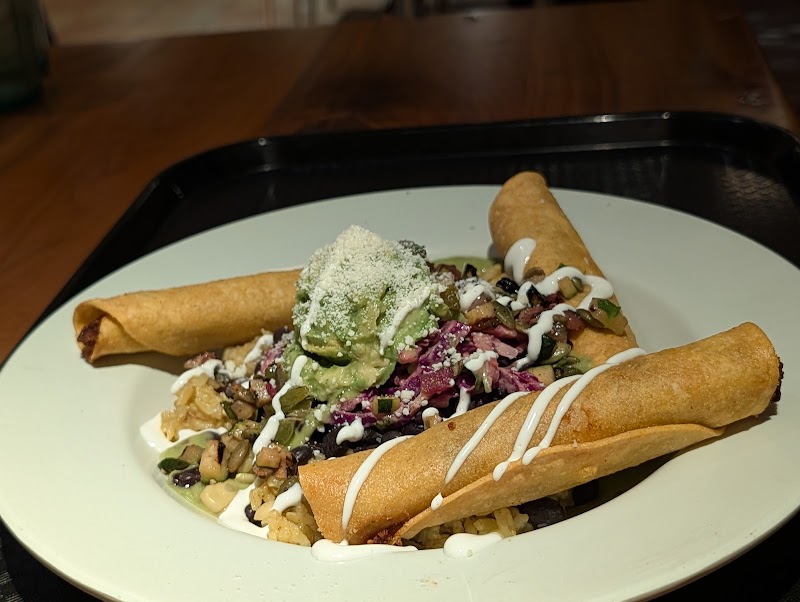 Crispy taquitos, vibrant toppings