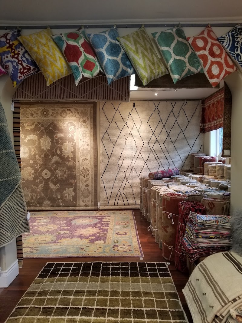 Colorful rugs, pillows displayed