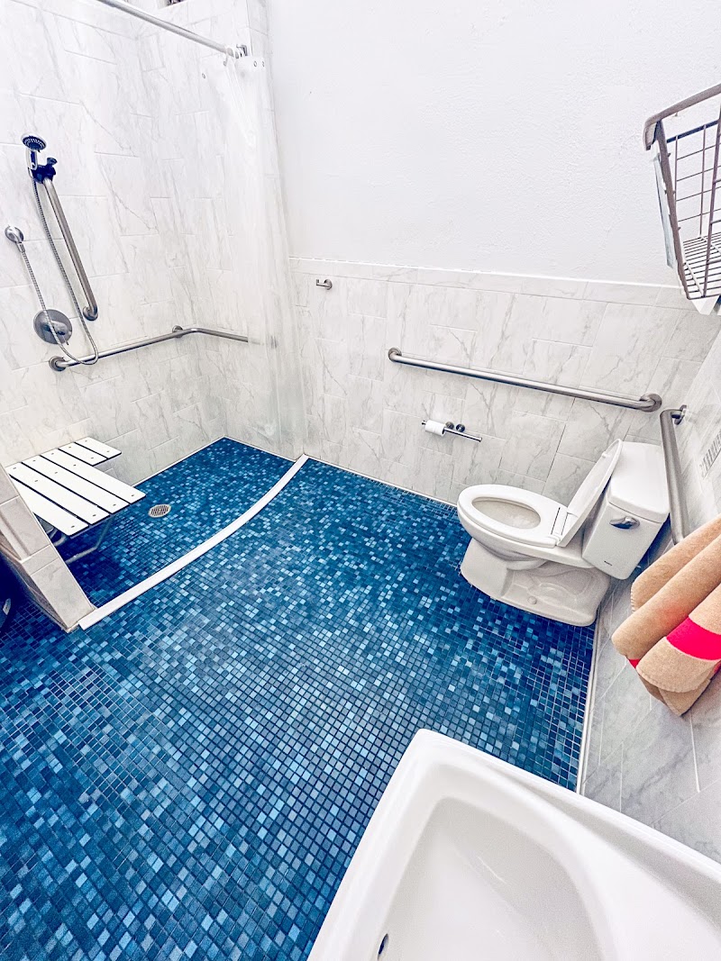 Clean tiled bathroom suite